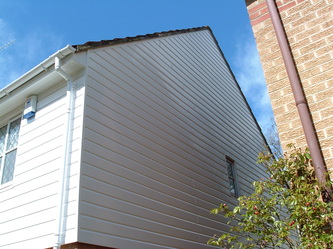 White UPVC cladding to gable