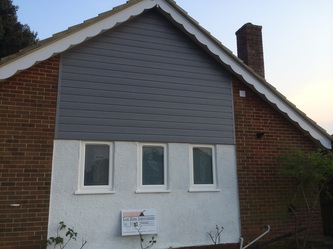 Grey Grained UPVC Cladding and White Decorative Bargeboard