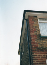 UPVC White fascia soffit black round guttering and down pipes