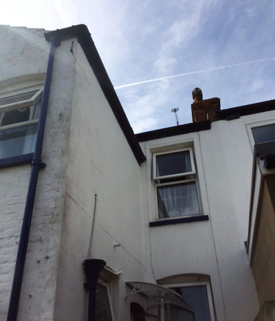 Degraded and flaking masonry paint