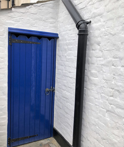 Shed door repainted using oil based undercoat and gloss