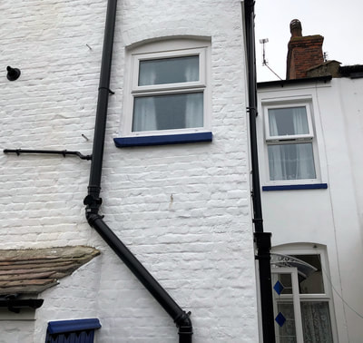 New masonry paint and soil vent downpipes