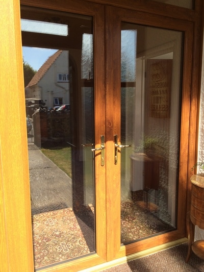 French doors high security double glazed UPVC  oak grain