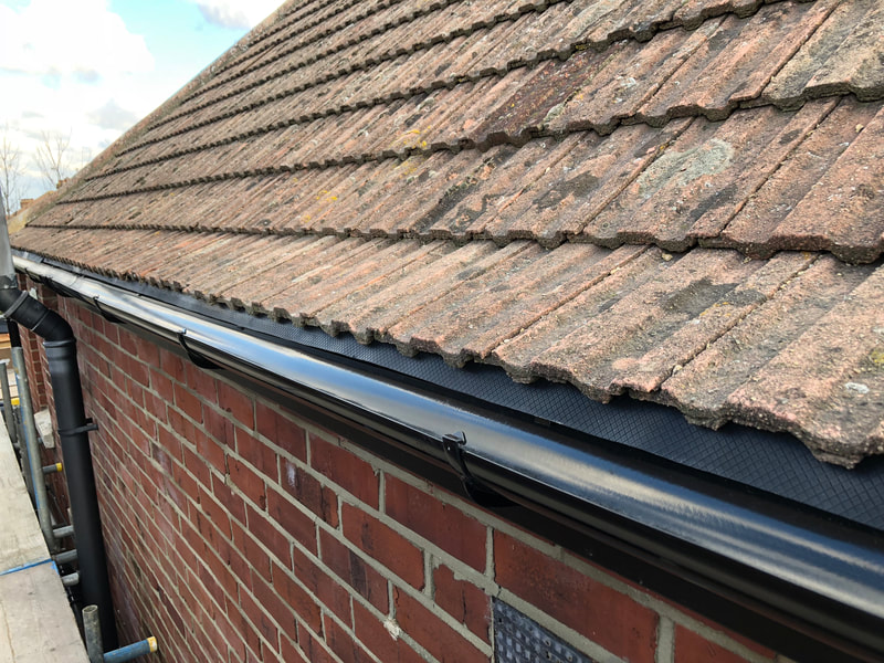 Black round gutter to fascia