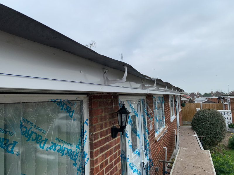 Gutter fascia brackets fitted to string line
