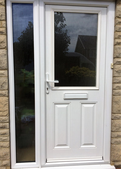 White grain double glazed UPVC composite door and side panel