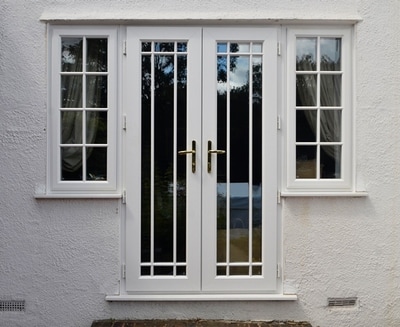 French doors high security double glazed UPVC  white and side panels Georgian bar